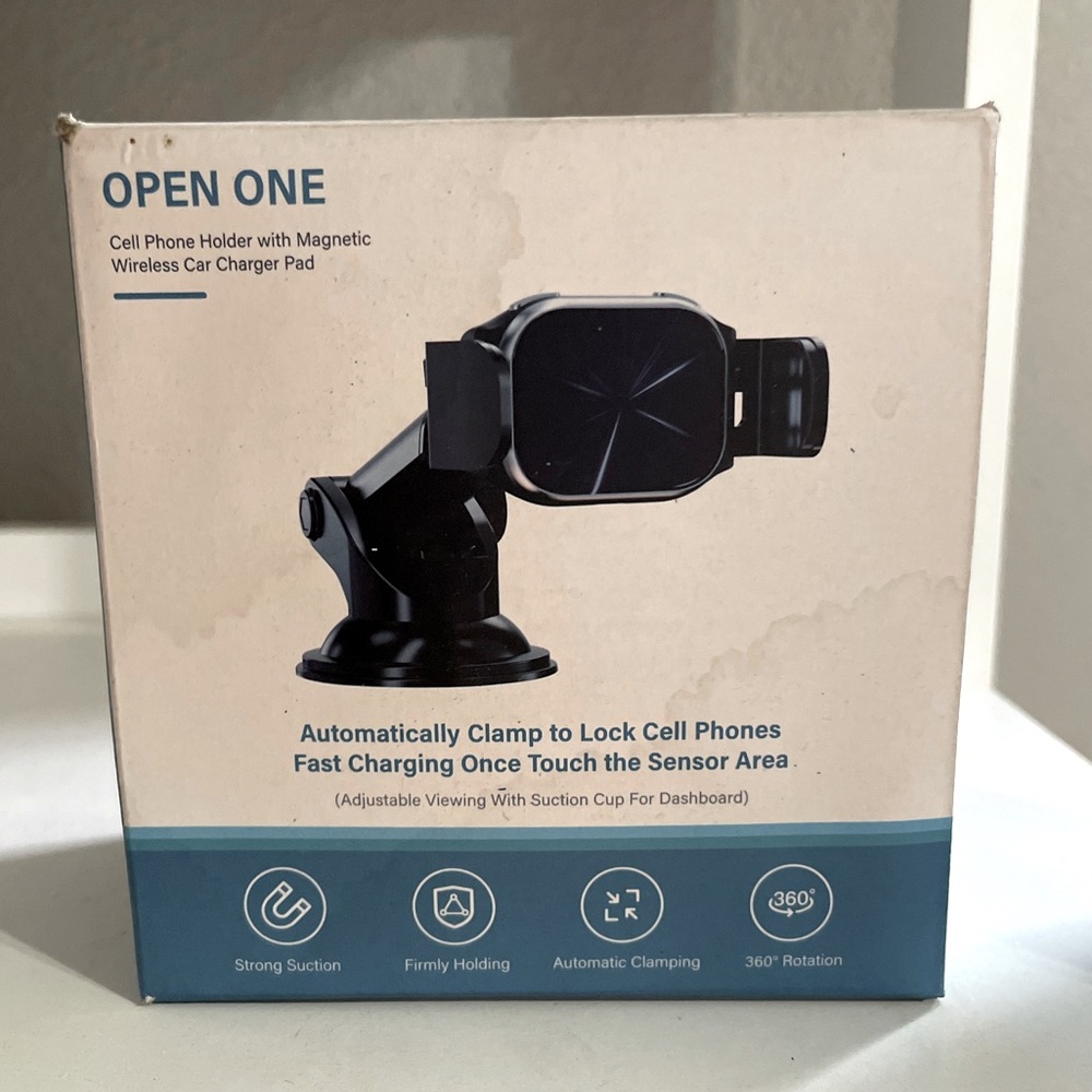 Cell phone holder with magnetic car charger - Open One
